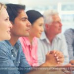 Group of people listening to a speaker - social media example